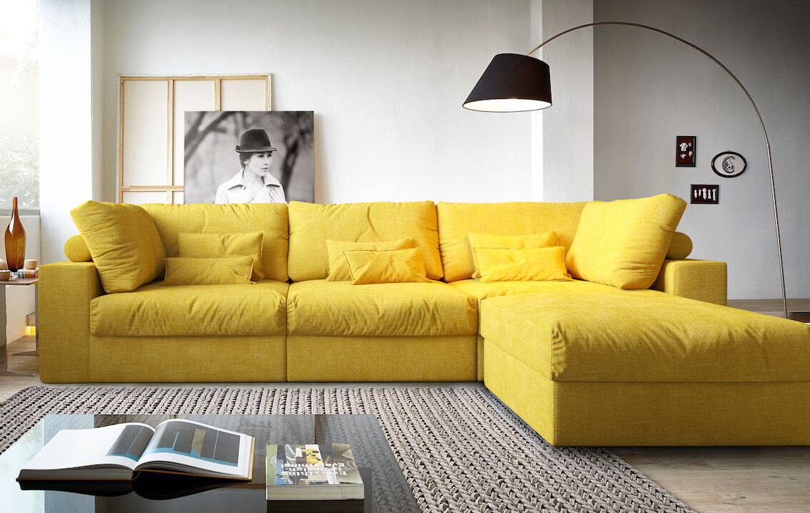 Угловой диван в интерьере гостиной