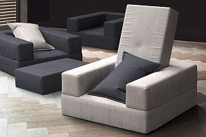 Кресла антивандальные, кресло-трансформер Кубис серого и черного цвета в гостиной